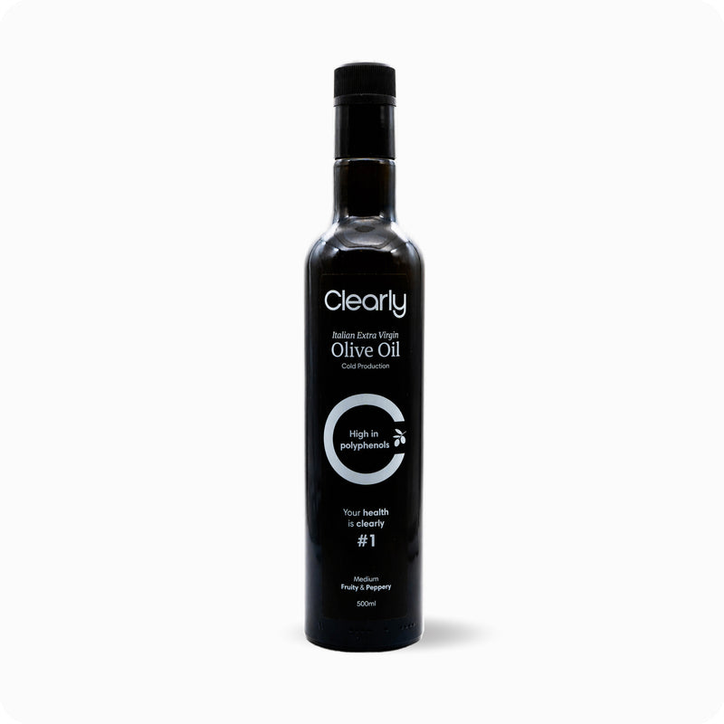 Clearly extra virgin olive oil bottle with a green label, showcasing a golden-yellow oil inside in a clear glass container
