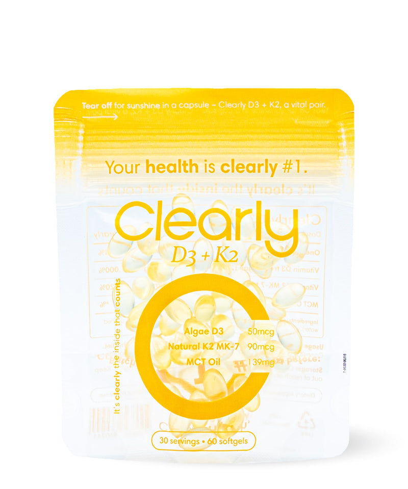 Bottle of Clearly D3 + K2 supplement with the label visible, showcasing the dietary supplement packaging on a white background.