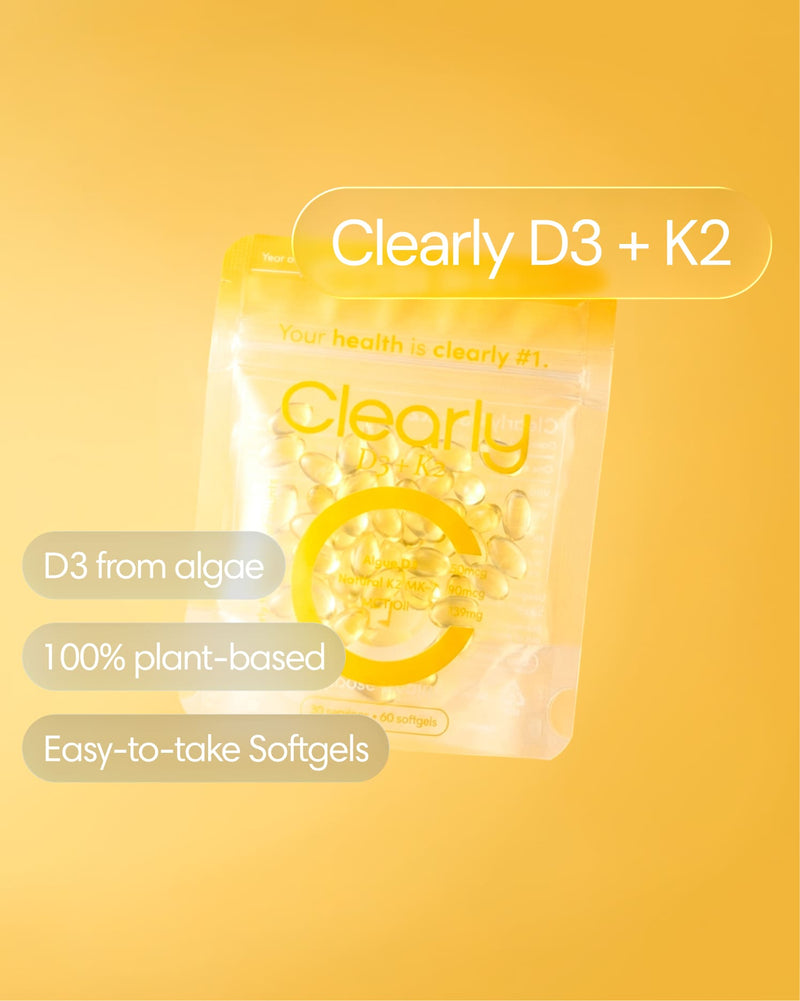 Clearly D3 + K2 supplement bottle with label visible, featuring two capsules on a white background.