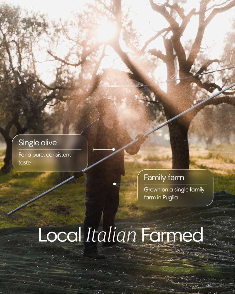 Clearly brand extra virgin olive oil bottle with a family farm label, showcasing a small dark glass bottle on a neutral background.