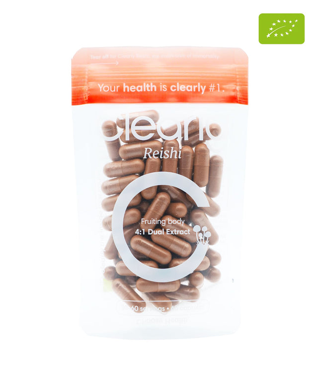 Organic Reishi capsules by Clearly, featuring a close-up of the supplement bottle and capsules on a white background.